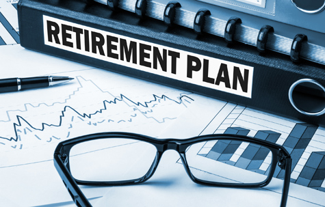 Retirement Plan With Graphs And Glasses On Desk